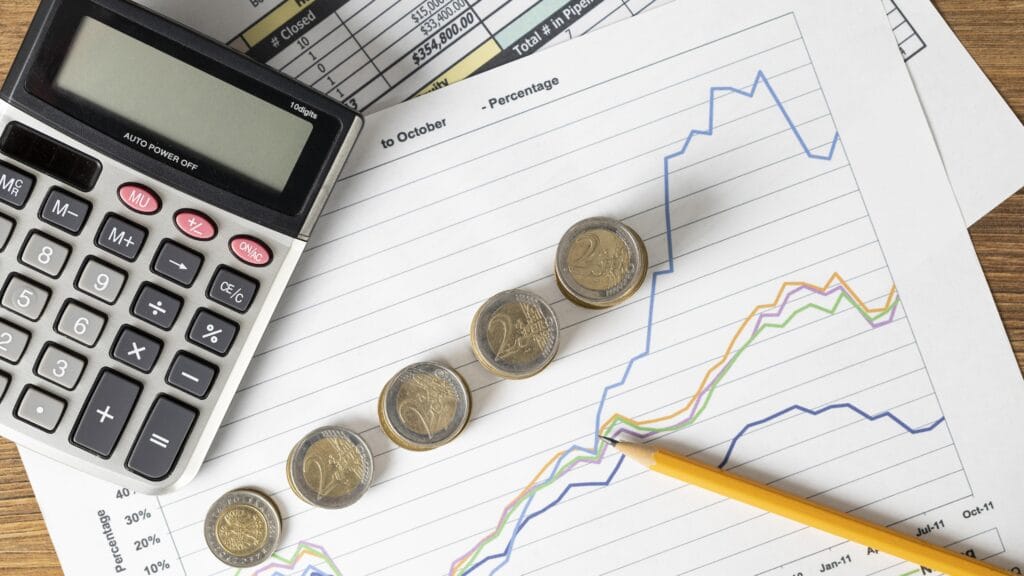 calculadores, moedas e papeis